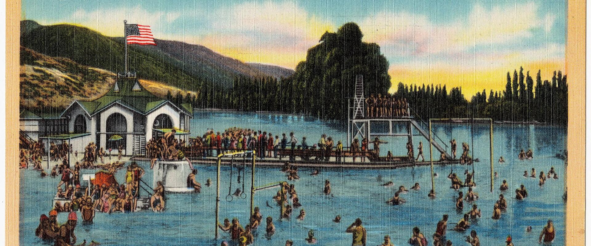 A vintage linen postcard depicting a crowded swimming lagoon with a large American flag, a lifeguard tower, and a building with arched entrances, labeled "Fresh Water Bathing, Lagoon, Fun Spot of Utah".