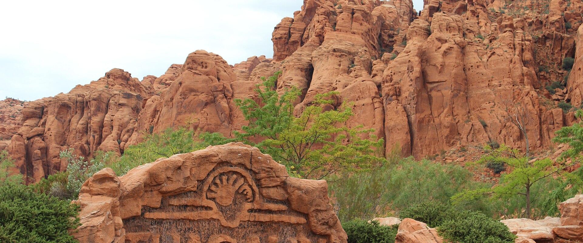 The Tuacahn sign beneath red cliffs