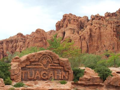 The Tuacahn sign beneath red cliffs