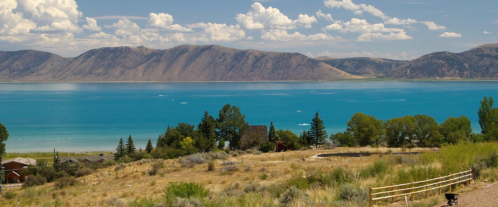 Turquoise water of Bear Lake below the hills of the Utah shore